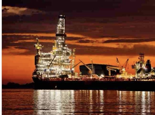 Offshore industrial structure at sunset